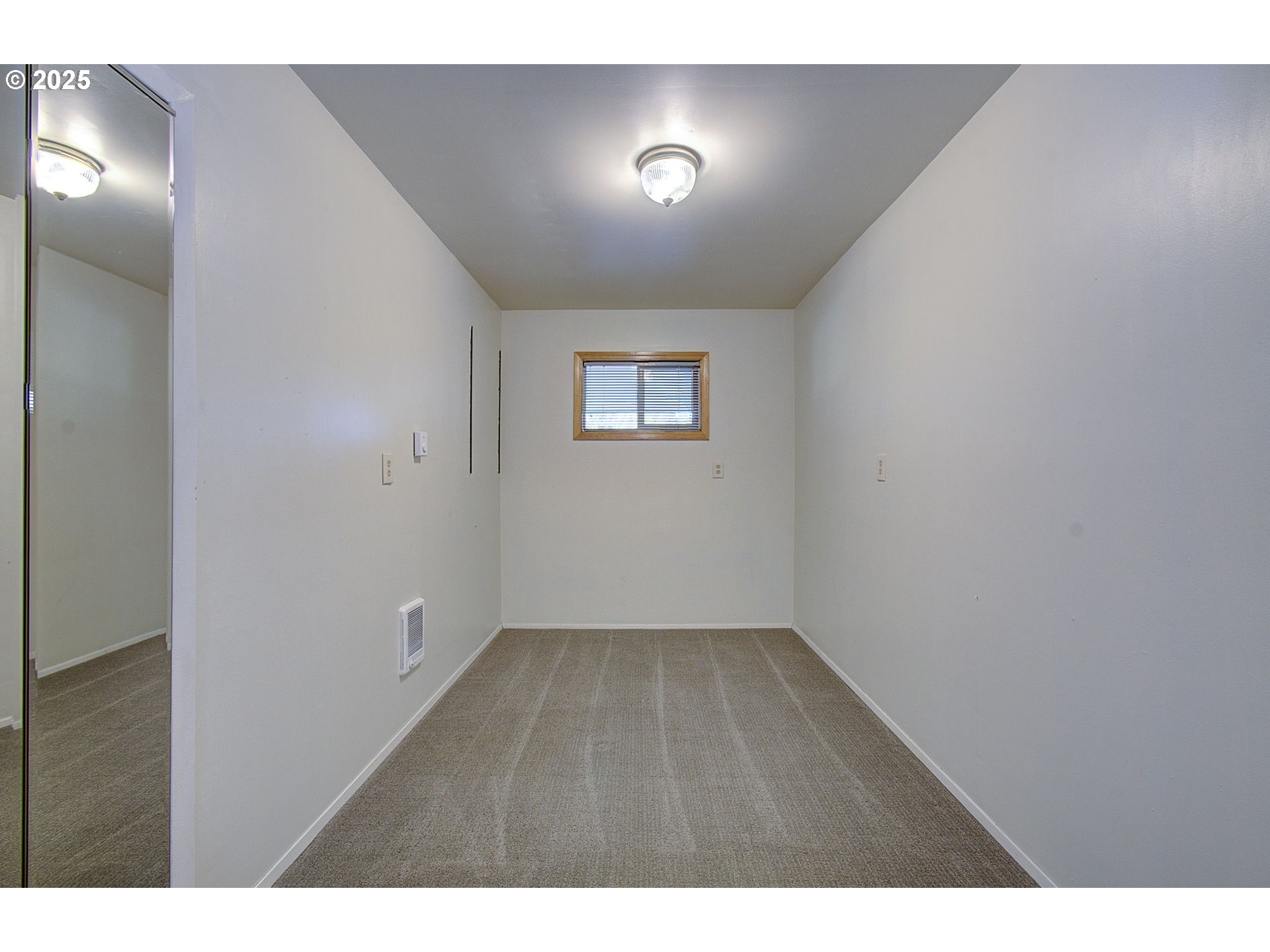 5911 Alki Road Vancouver, WA 98663 - Photo 17 of 29 a view of an empty room with a window