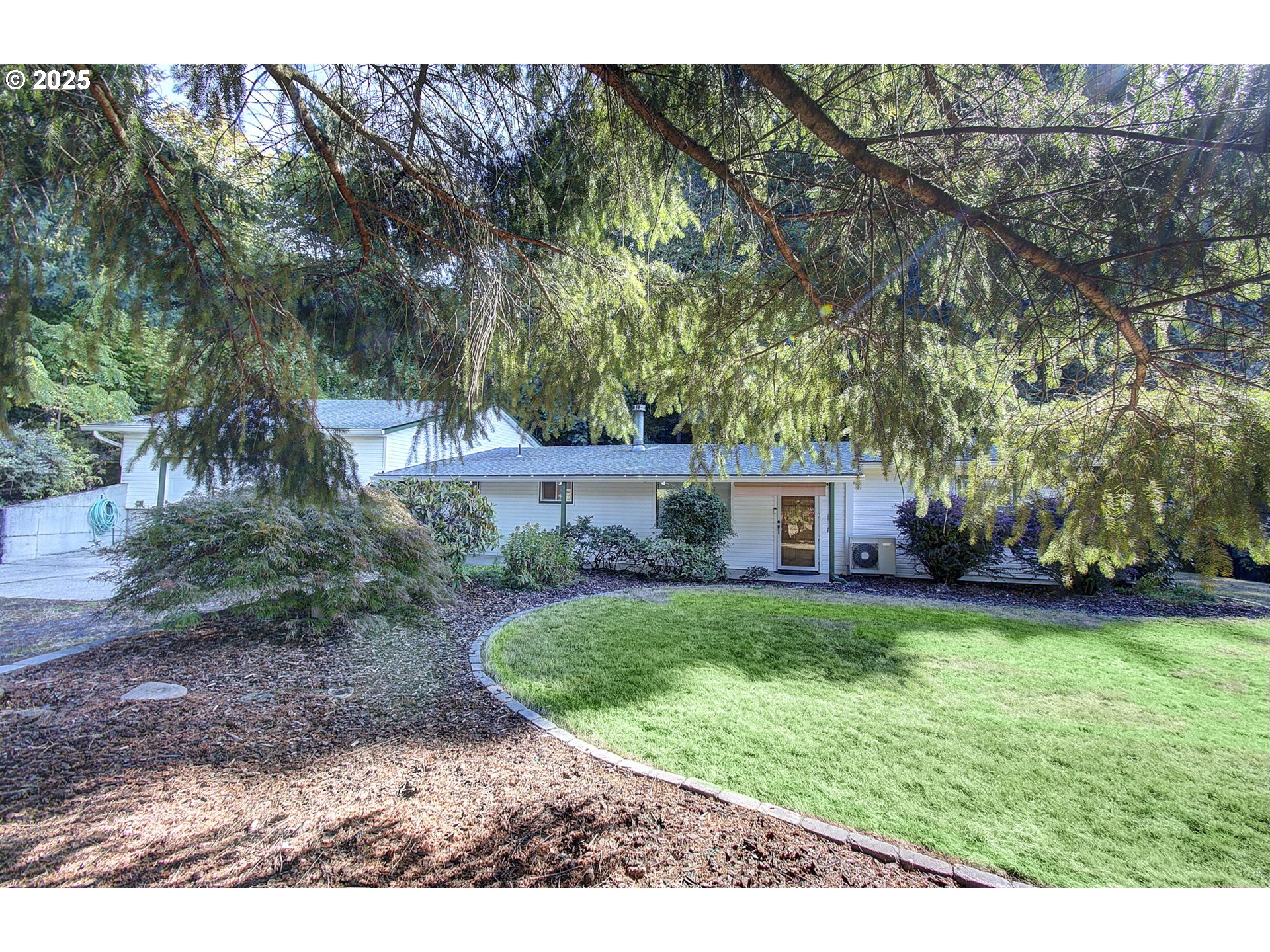 5911 Alki Road Vancouver, WA 98663 - Photo 2 of 29 a view of a wooden house with a yard