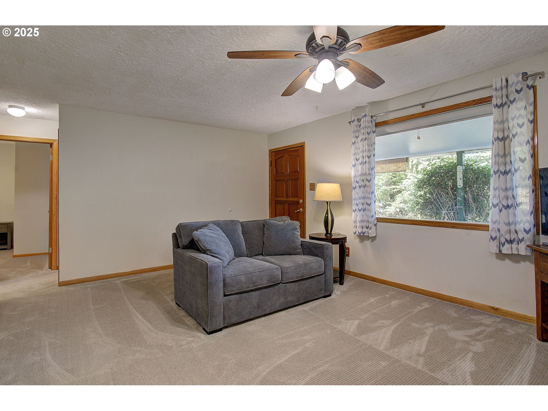 5911 Alki Road Vancouver, WA 98663 - Photo 7 of 29 a living room with furniture and a large window