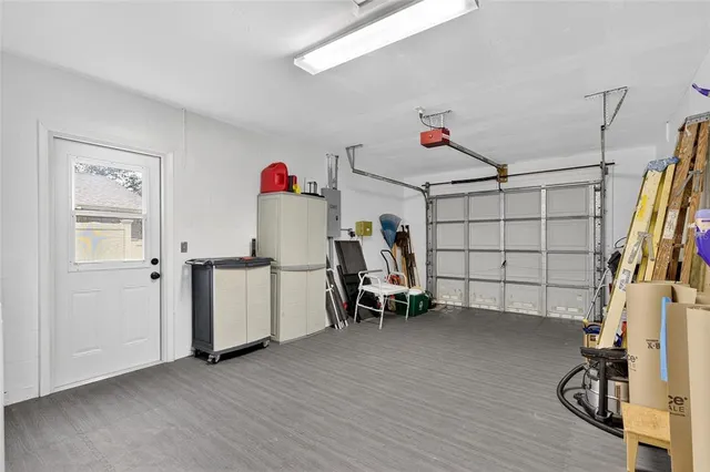a view of a livingroom with furniture and a hallway