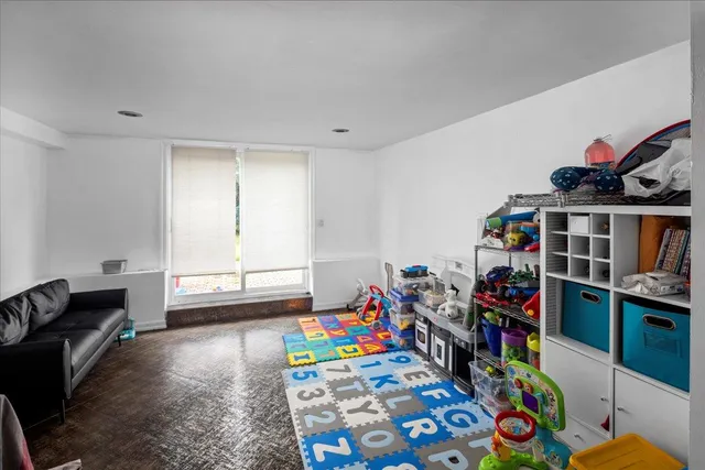 a children room with furniture and toys