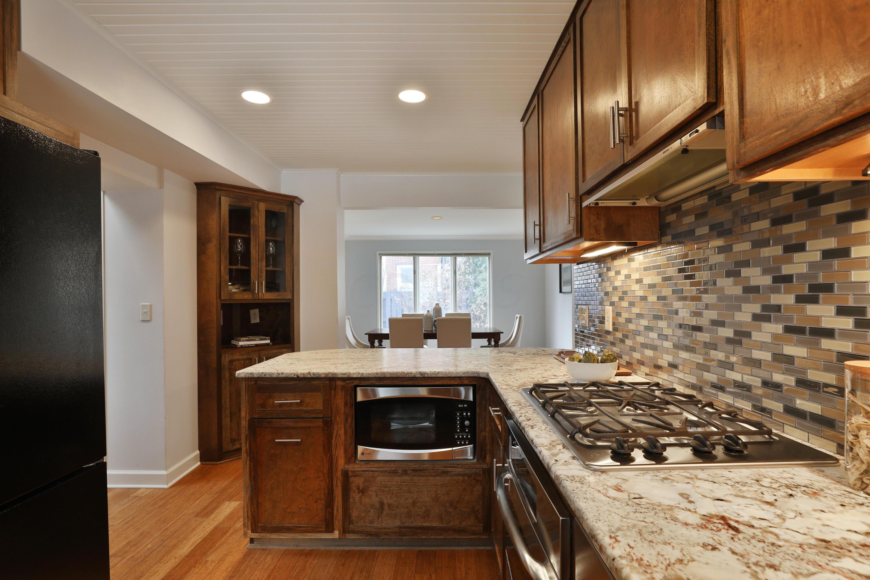 2180 Bryden Road Columbus, OH 43209 - Photo 21 of 56 Leathered countertops and abundant, custom cabinetry. Loads of counter space.