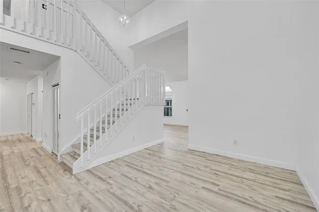a view of entryway with wooden floor