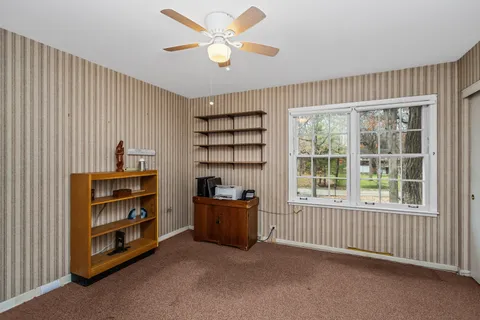 a view of a livingroom with furniture and windows