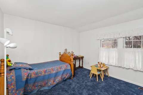 a bedroom with furniture and a bed