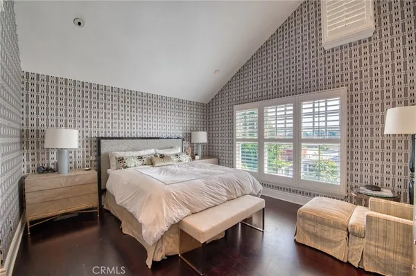 a bedroom with a bed and a couch