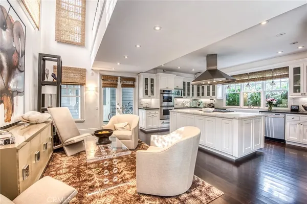 a living room with kitchen island furniture and a large window