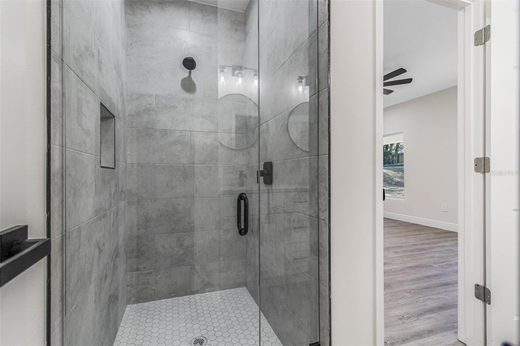 406 Ruby Avenue Deland, FL 32724 - Photo 11 of 23 a bathroom with a shower
