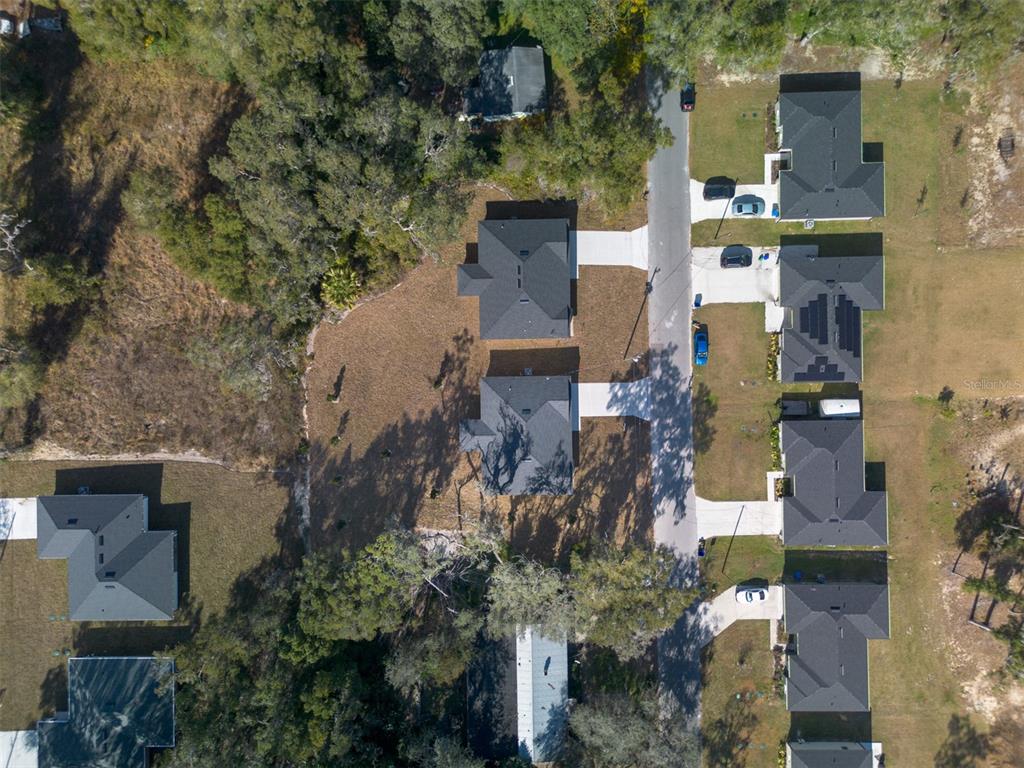 406 Ruby Avenue Deland, FL 32724 - Photo 21 of 23 an aerial view of residential houses with outdoor space