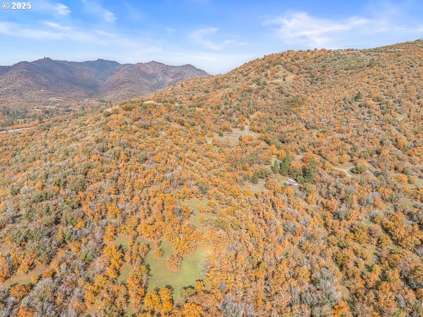 11926 Blackwell Road Central Point, OR 97502 - Photo 11 of 18 a view of a large mountain with mountains in the background