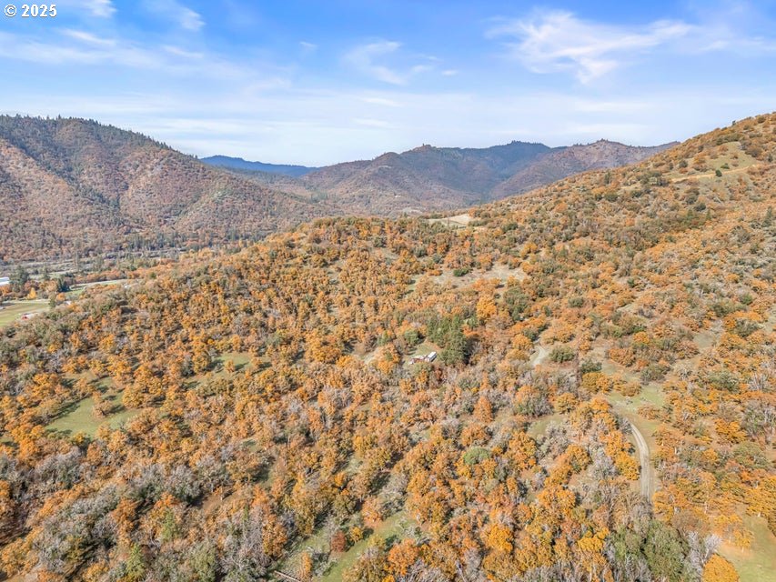 11926 Blackwell Road Central Point, OR 97502 - Photo 6 of 18 a view of a large mountain with mountains in the background