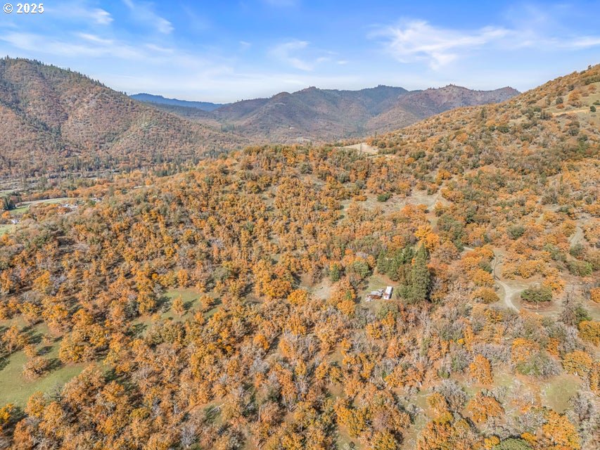 11926 Blackwell Road Central Point, OR 97502 - Photo 10 of 18 a view of a dry yard with mountains in the background