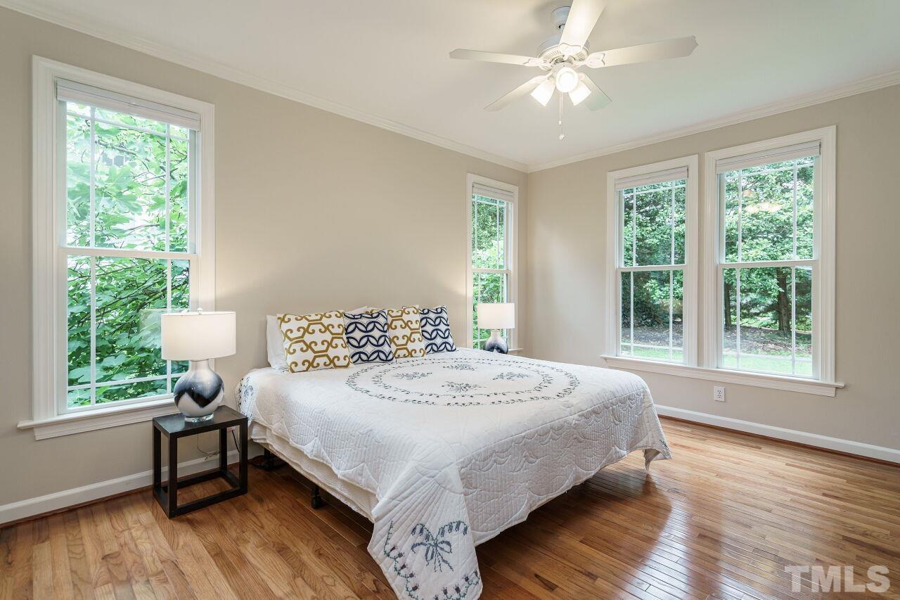 206 Firetree Lane Cary, NC 27513 - Photo 16 of 44 a bedroom with a bed and a window
