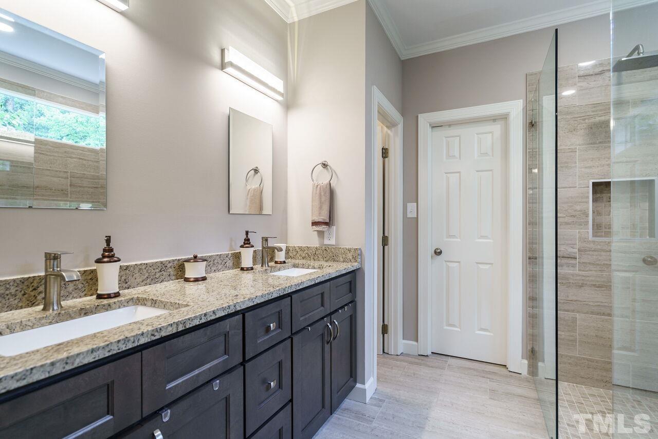 206 Firetree Lane Cary, NC 27513 - Photo 17 of 44 a bathroom with a granite countertop double vanity sink mirror and double