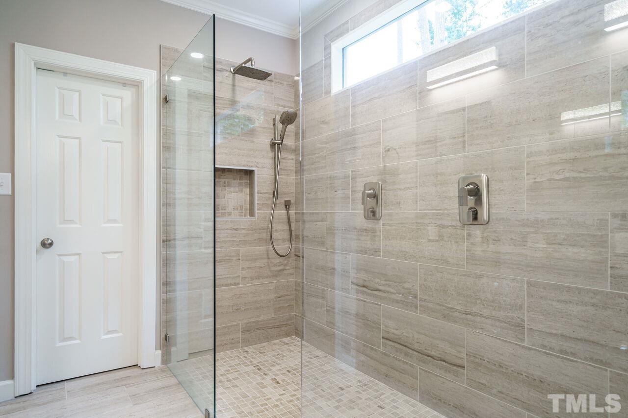 206 Firetree Lane Cary, NC 27513 - Photo 18 of 44 a bathroom with a shower