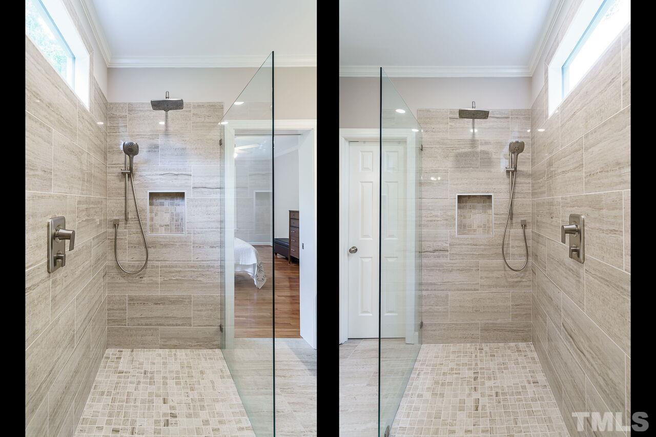 206 Firetree Lane Cary, NC 27513 - Photo 19 of 44 a bathroom with a glass door shower