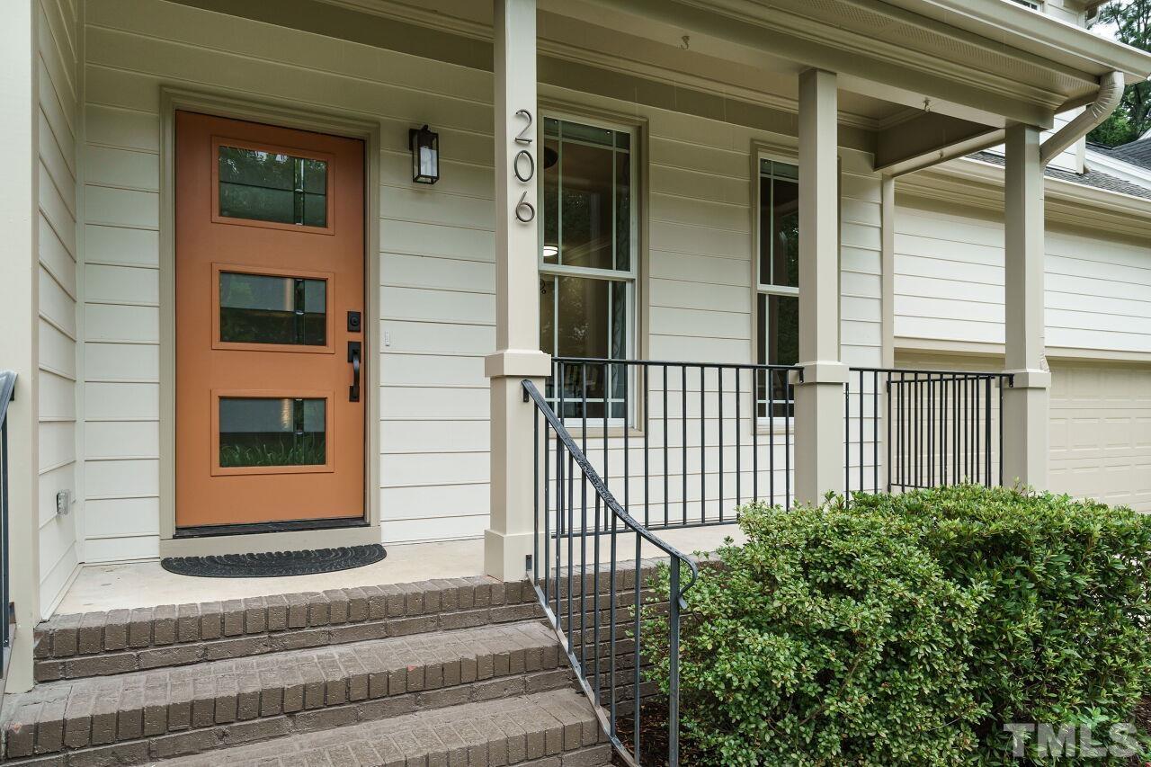 206 Firetree Lane Cary, NC 27513 - Photo 2 of 44 a view of entrance of house