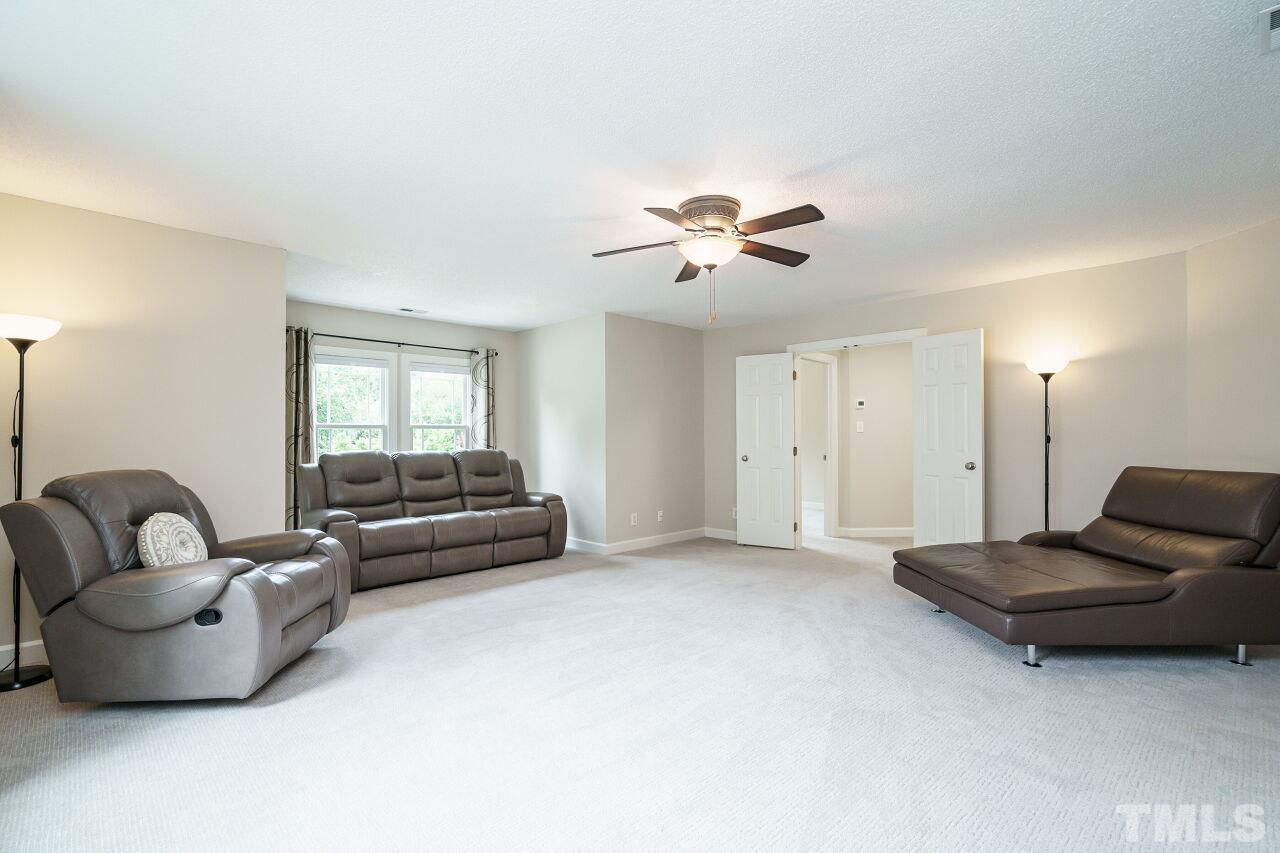 206 Firetree Lane Cary, NC 27513 - Photo 25 of 44 a living room with furniture and a window