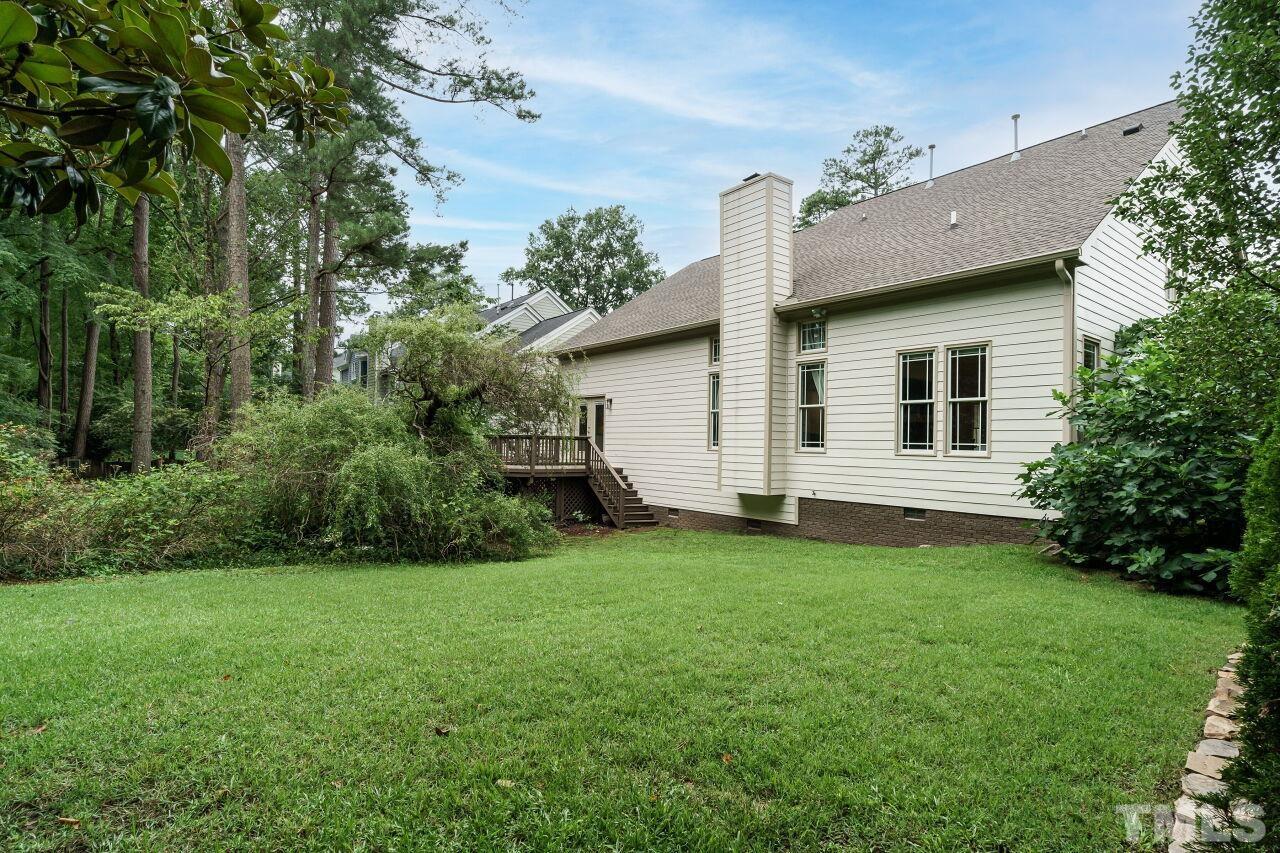 206 Firetree Lane Cary, NC 27513 - Photo 29 of 44 a view of a house with a backyard