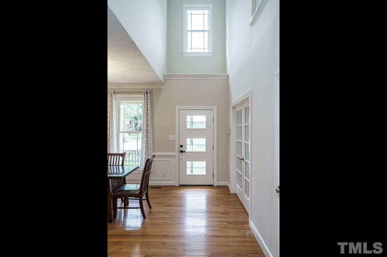 206 Firetree Lane Cary, NC 27513 - Photo 3 of 44 a view interior of a house with wooden floor windows and stairs