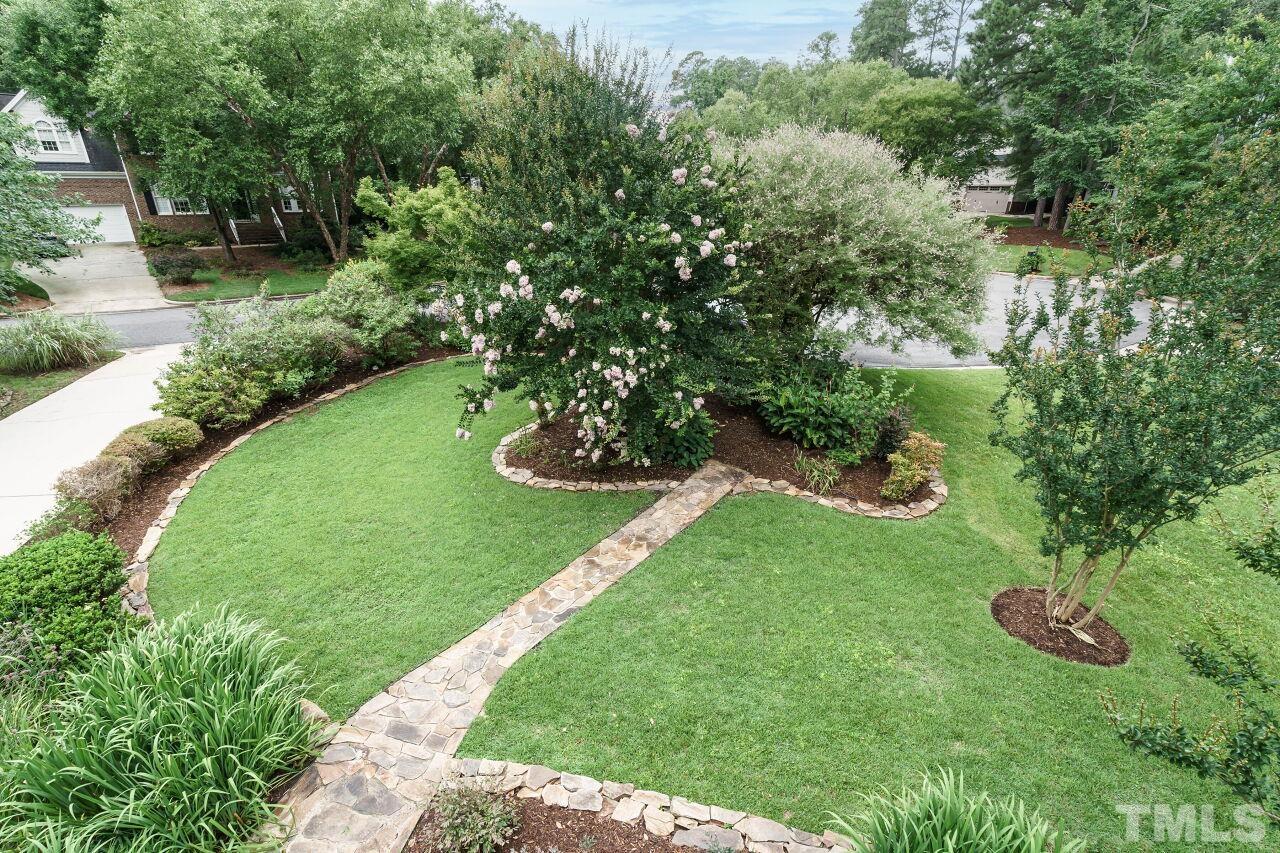 206 Firetree Lane Cary, NC 27513 - Photo 30 of 44 a view of a house with a yard