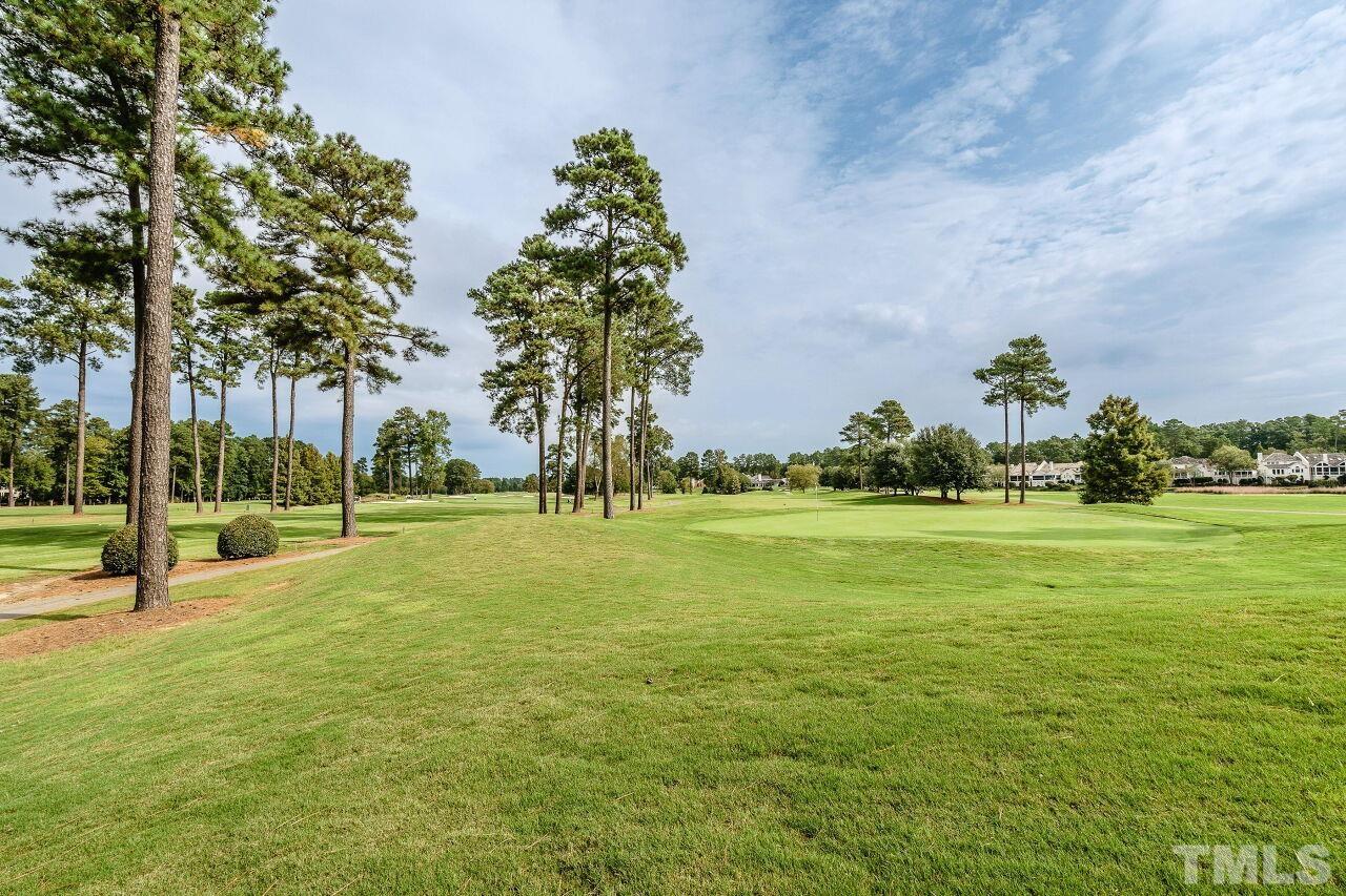 206 Firetree Lane Cary, NC 27513 - Photo 36 of 44 a view of a playground with basketball court