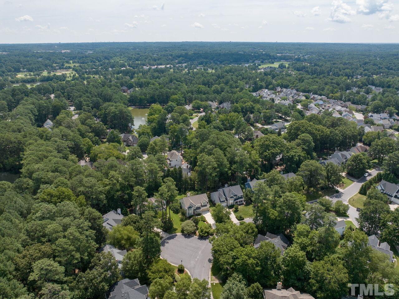 206 Firetree Lane Cary, NC 27513 - Photo 42 of 44 an aerial view of houses with yard and trees