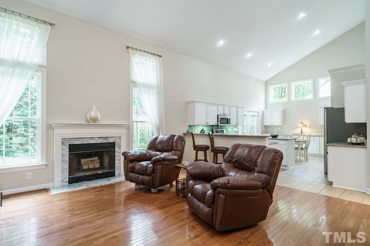 206 Firetree Lane Cary, NC 27513 - Photo 44 of 44 a living room with furniture and a fireplace