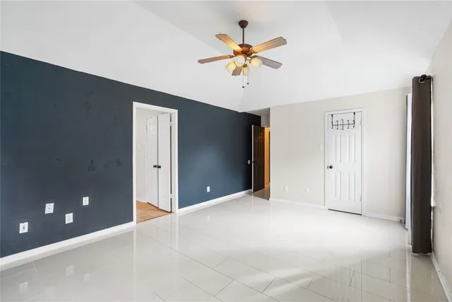 a view of an empty room with a window