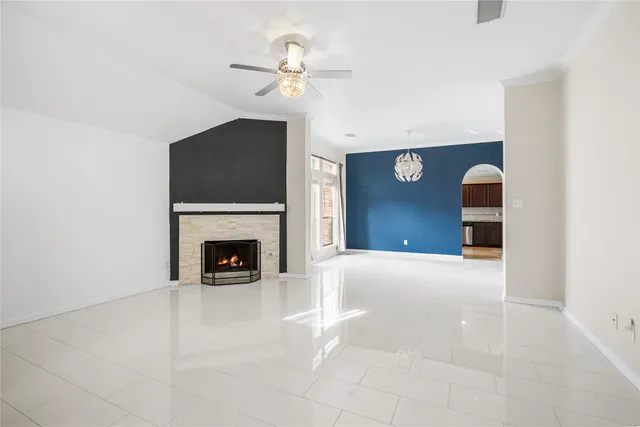 a view of a livingroom with a fireplace and window