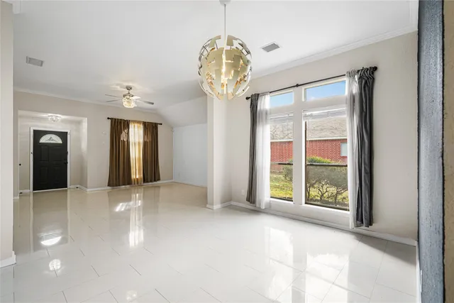 a view of an entryway with a chandelier