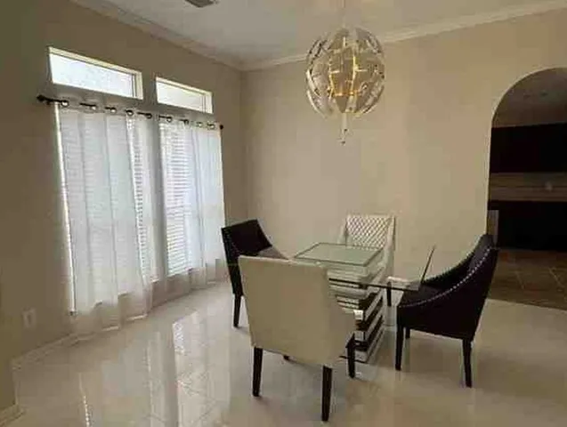 a view of a room with furniture and a window