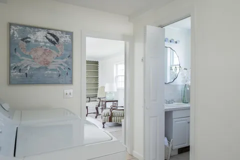 a bathroom with a bathtub sink and mirror
