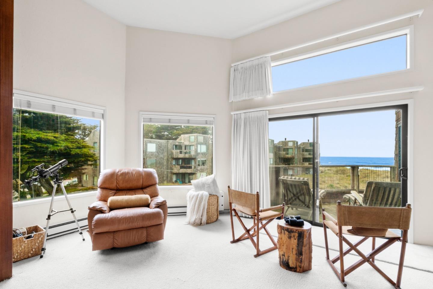 101 Shell Road, Unit 127 Watsonville, CA 95076 - Photo 14 of 54 a living room with furniture and a floor to ceiling window