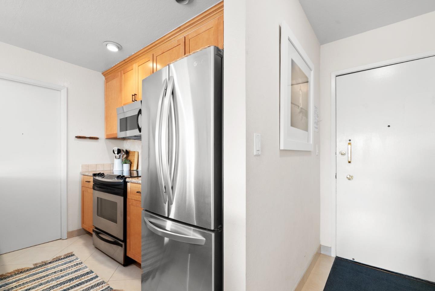 101 Shell Road, Unit 127 Watsonville, CA 95076 - Photo 24 of 54 a kitchen with stainless steel appliances a refrigerator and a window