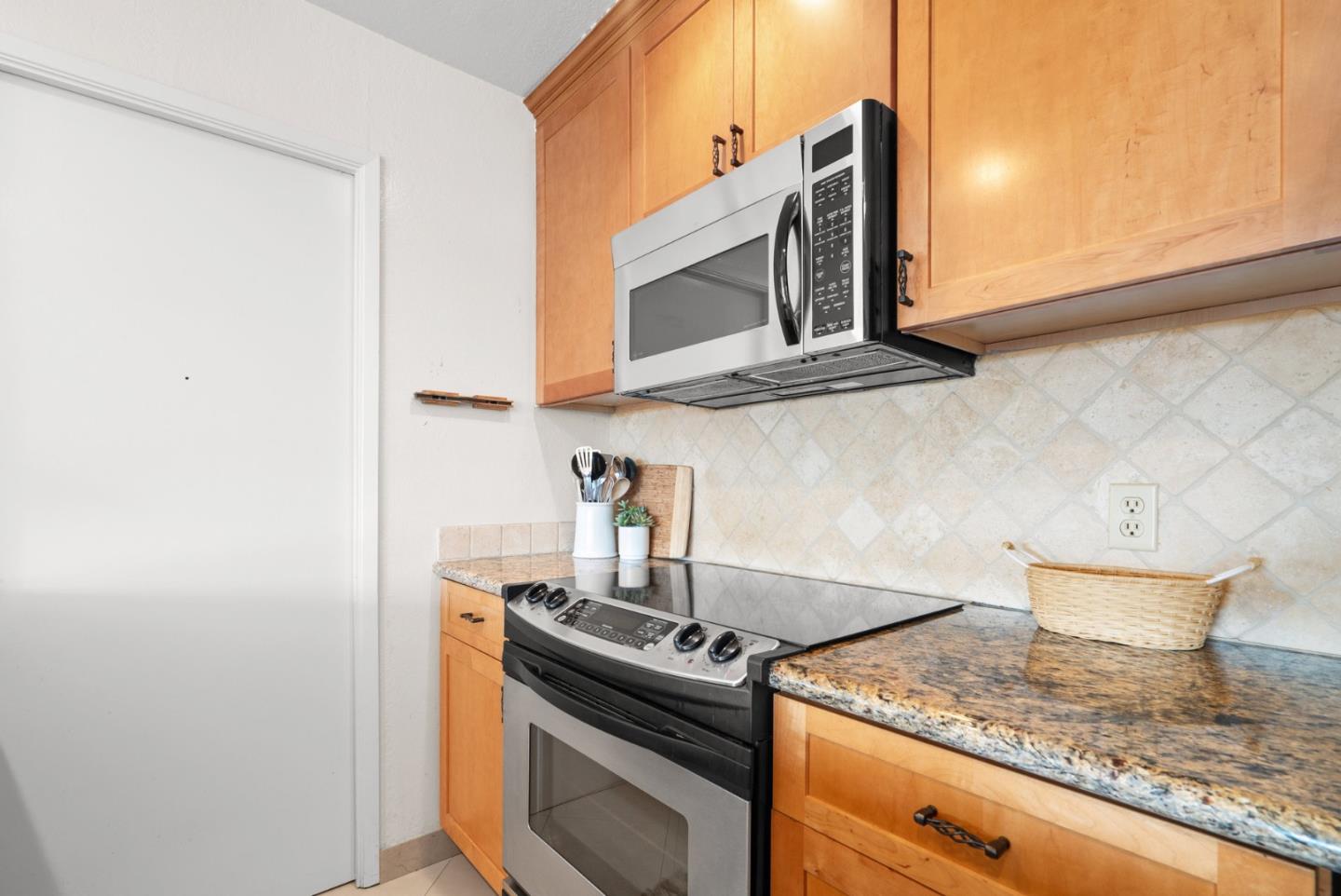 101 Shell Road, Unit 127 Watsonville, CA 95076 - Photo 25 of 54 a kitchen with a stove and a microwave