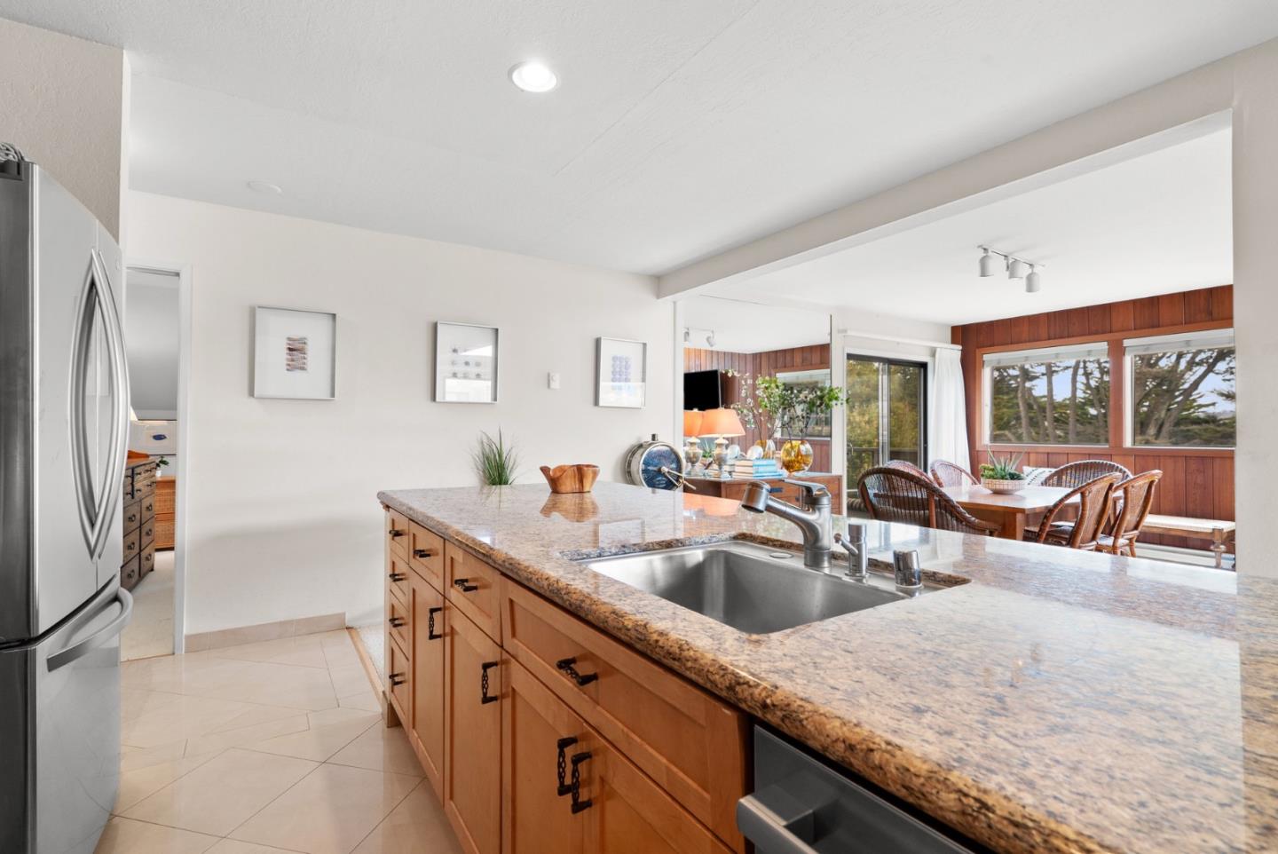 101 Shell Road, Unit 127 Watsonville, CA 95076 - Photo 27 of 54 a kitchen with granite countertop a sink and a refrigerator