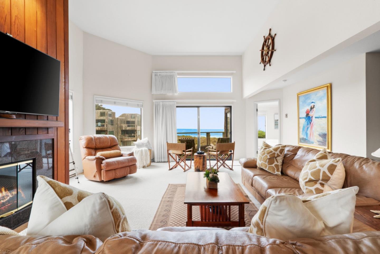 101 Shell Road, Unit 127 Watsonville, CA 95076 - Photo 3 of 54 a living room with fireplace furniture and a flat screen tv
