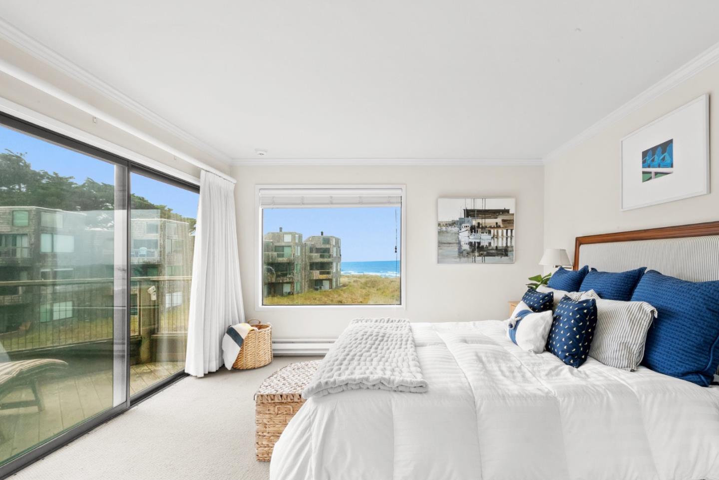 101 Shell Road, Unit 127 Watsonville, CA 95076 - Photo 35 of 54 a bedroom with a large bed and a large window with outer view