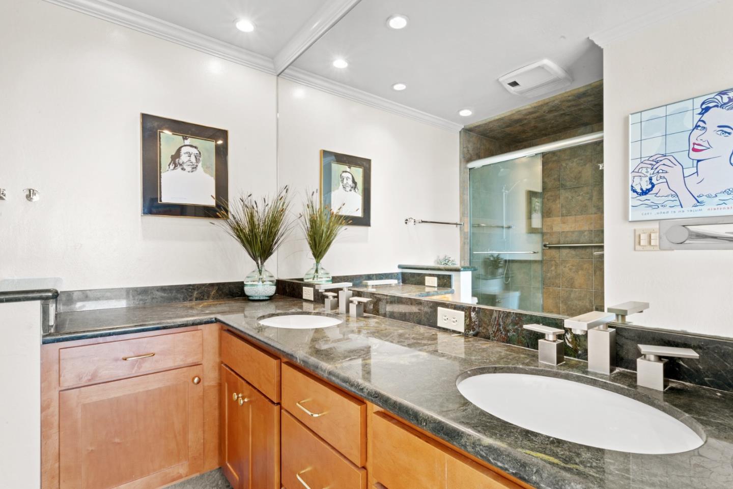 101 Shell Road, Unit 127 Watsonville, CA 95076 - Photo 38 of 54 a bathroom with double vanity sinks a two mirror and a shower