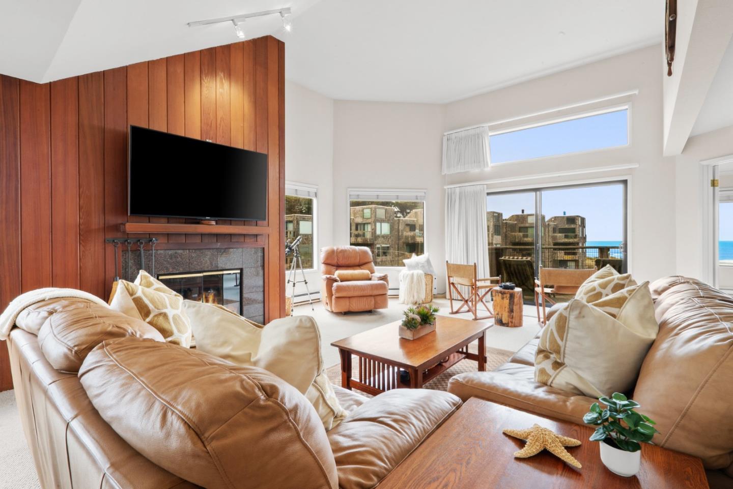 101 Shell Road, Unit 127 Watsonville, CA 95076 - Photo 4 of 54 a living room with furniture a flat screen tv and a fireplace