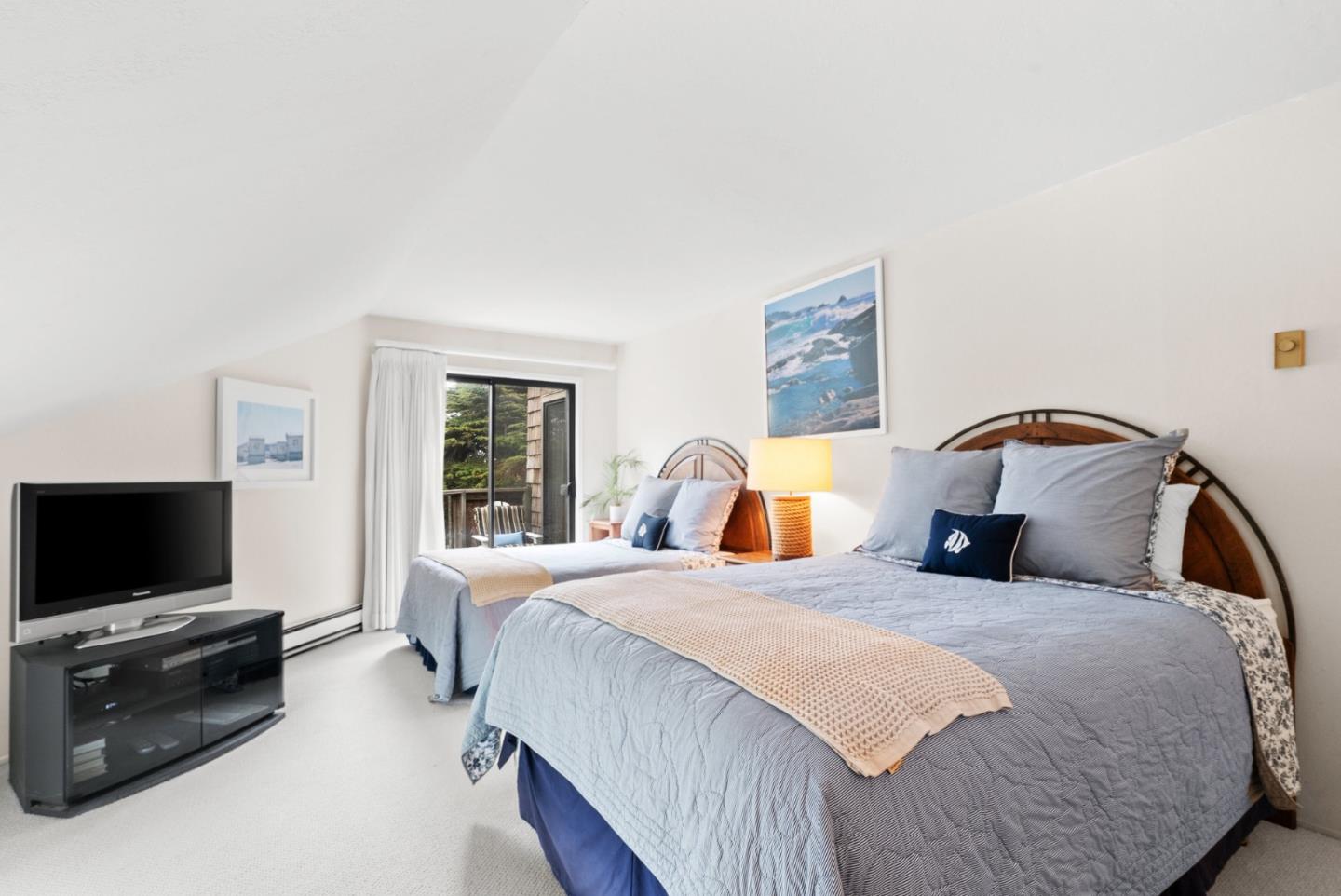 101 Shell Road, Unit 127 Watsonville, CA 95076 - Photo 41 of 54 a bedroom with a bed and a flat screen tv