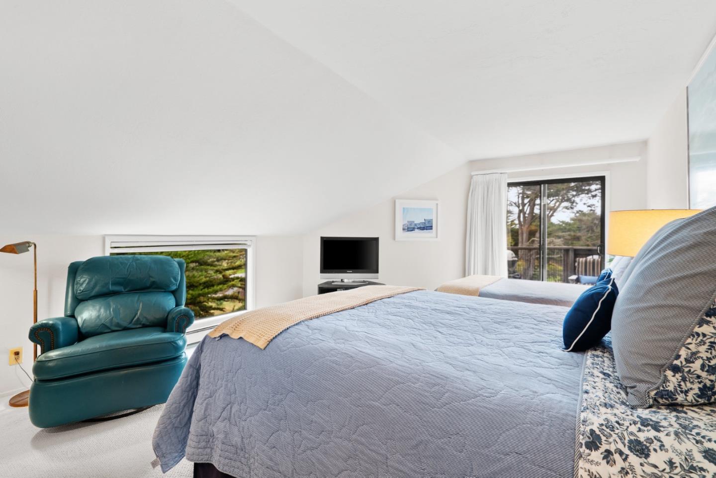 101 Shell Road, Unit 127 Watsonville, CA 95076 - Photo 44 of 54 a bedroom with a bed and a couch next to a window