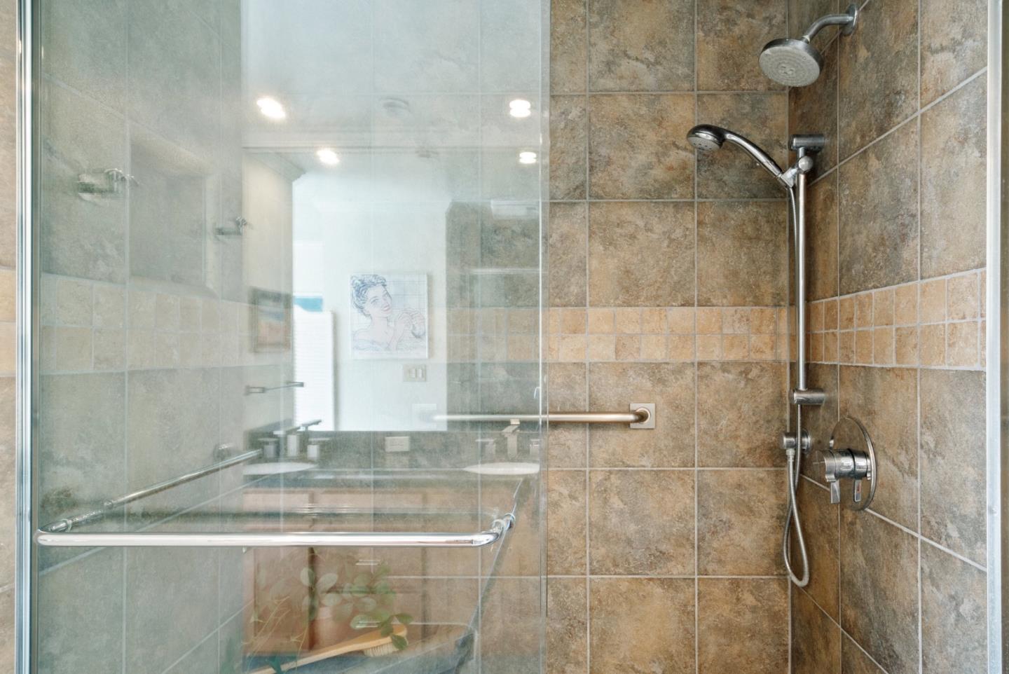 101 Shell Road, Unit 127 Watsonville, CA 95076 - Photo 46 of 54 a bathroom with a granite countertop sink a shower and a mirror