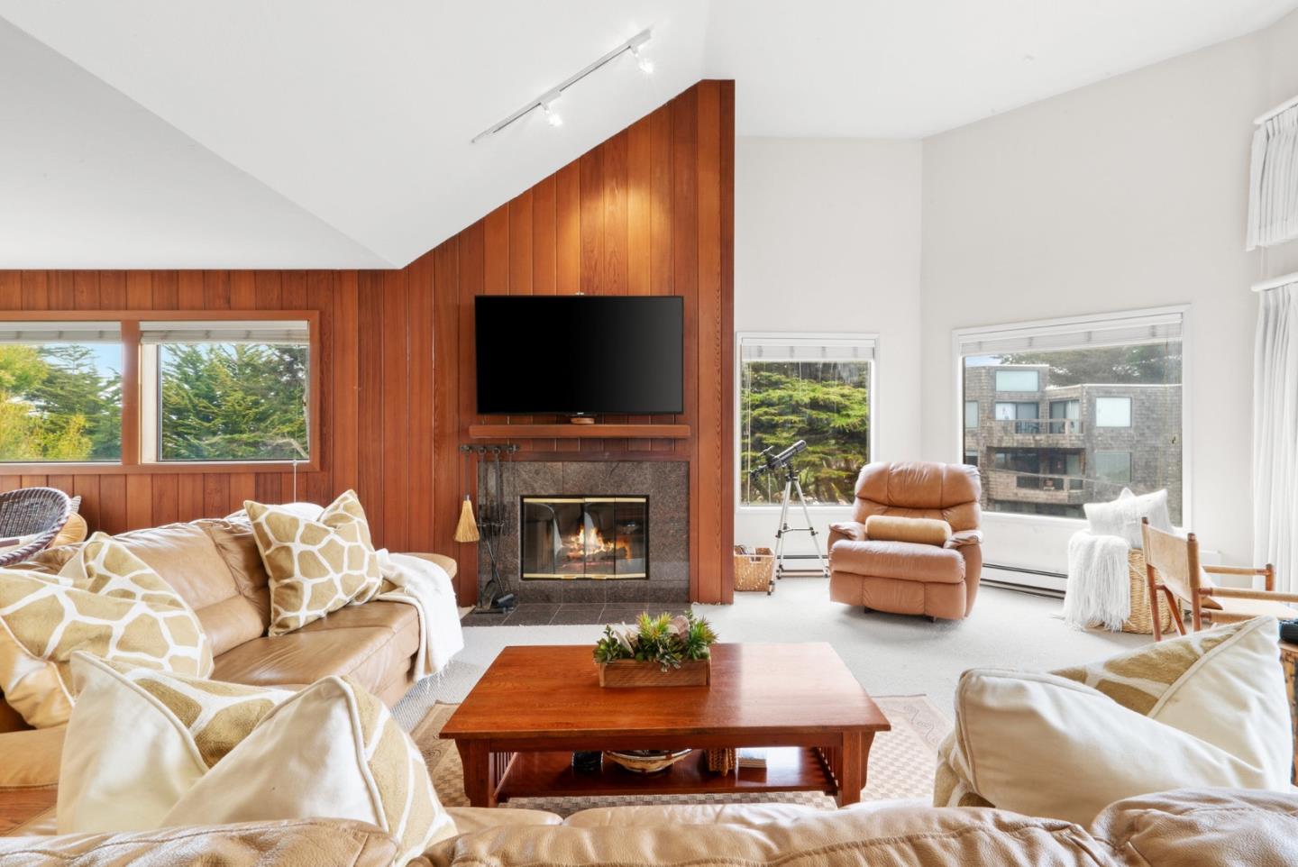 101 Shell Road, Unit 127 Watsonville, CA 95076 - Photo 5 of 54 a living room with furniture a fireplace and a flat screen tv