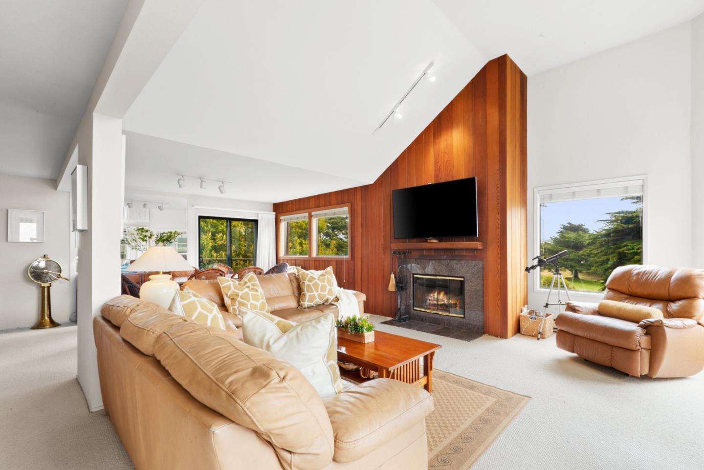 101 Shell Road, Unit 127 Watsonville, CA 95076 - Photo 6 of 54 a living room with fireplace furniture and a flat screen tv