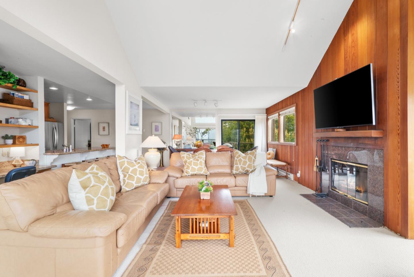 101 Shell Road, Unit 127 Watsonville, CA 95076 - Photo 7 of 54 a living room with fireplace furniture and a flat screen tv