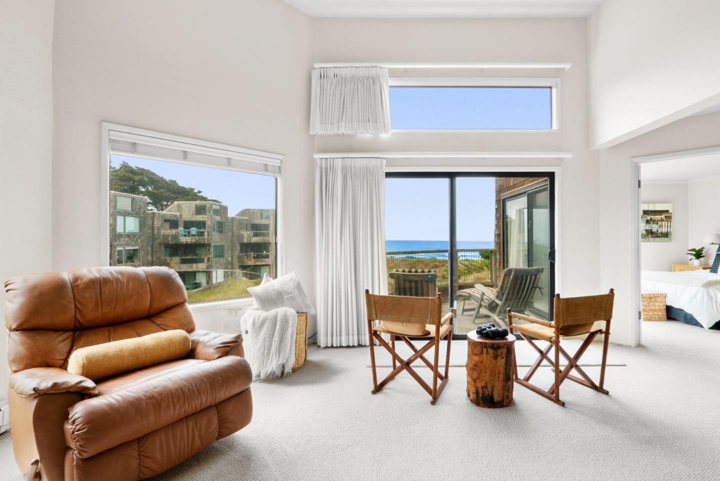 101 Shell Road, Unit 127 Watsonville, CA 95076 - Photo 10 of 54 a living room with furniture and a floor to ceiling window