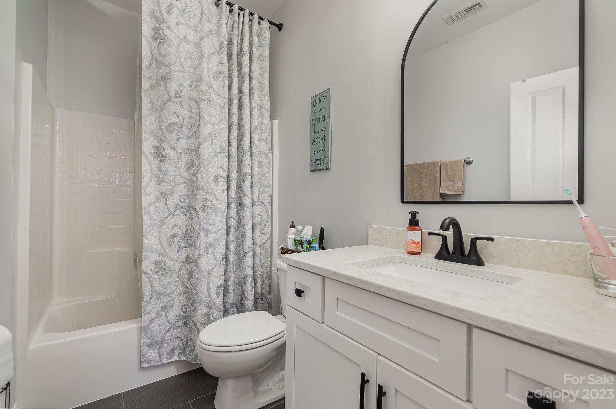 8128 Townley Road Huntersville, NC 28078 - Photo 11 of 20 a bathroom with a sink toilet and shower