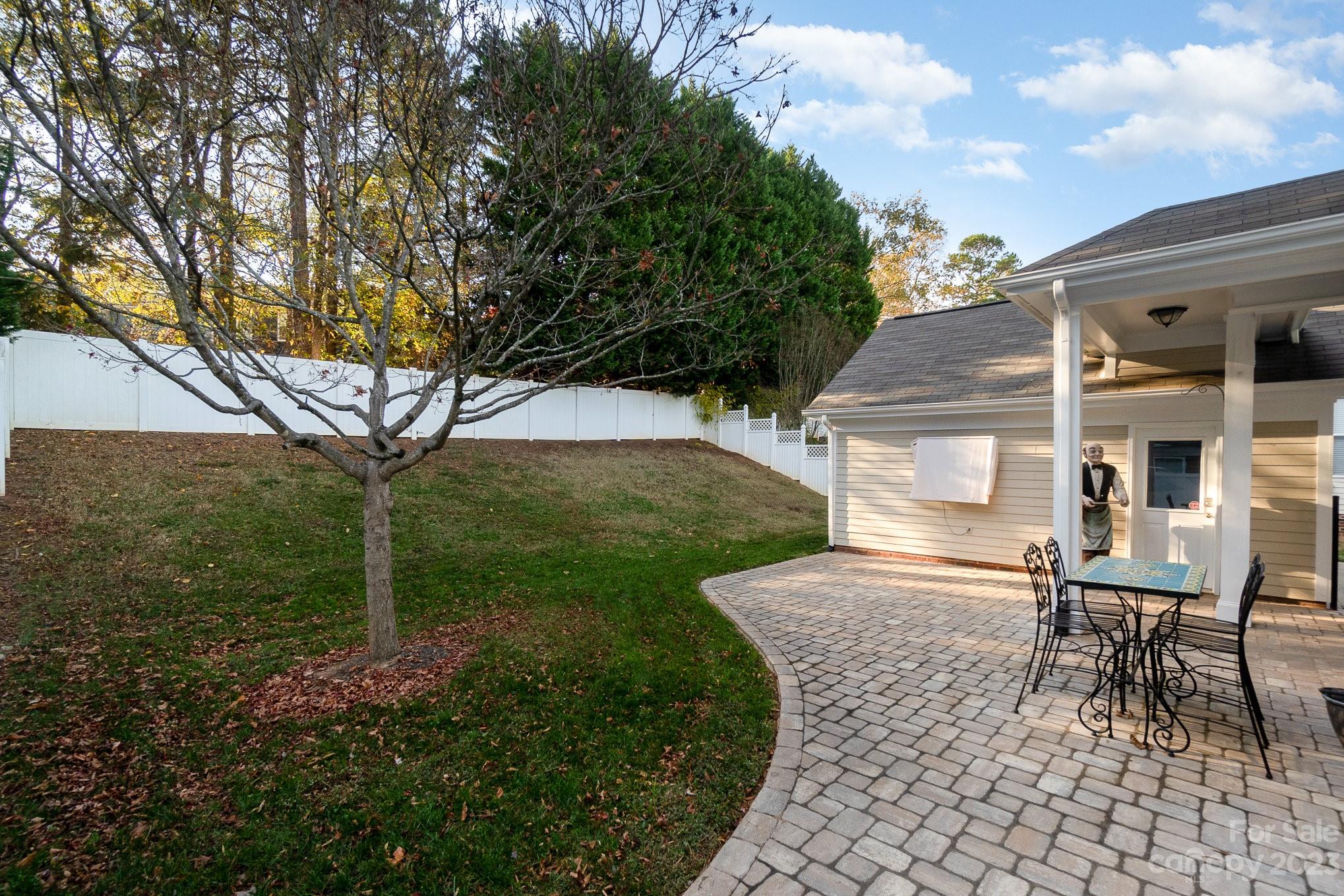 8128 Townley Road Huntersville, NC 28078 - Photo 19 of 20 a porch with a bench and chairs